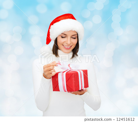 smiling woman in santa helper hat with gift box 12451612