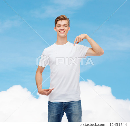 smiling young man in blank white t-shirt 12451844