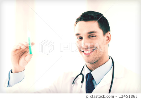male doctor holding syringe with injection male doctor holding syringe with injection 12451863