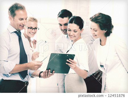 business team discussing something in office business team discussing something in office 12451876