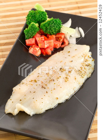 Fish fillet with avocado tatar 12452419