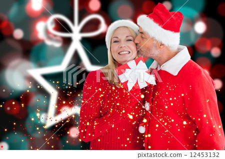 Composite image of festive couple Composite image of festive couple 12453132