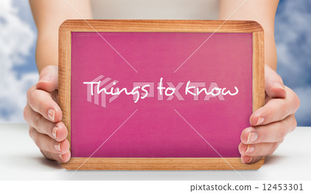 Composite image of females hands showing pink board Composite image of females hands showing pink board 12453301