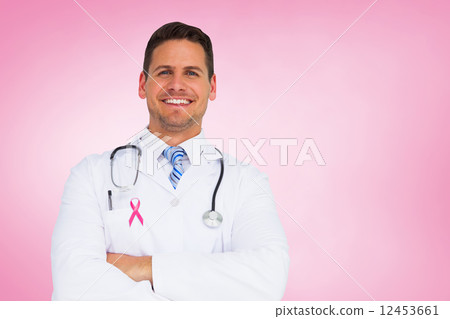 Composite image of handsome doctor with arms crossed Composite image of handsome doctor with arms crossed 12453661