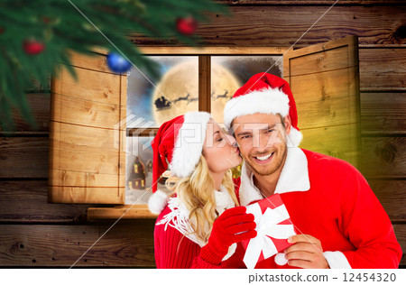 Composite image of young festive couple 12454320