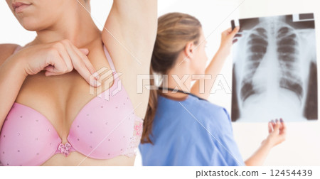 Composite image of woman performing self breast examination Composite image of woman performing self breast examination 12454439