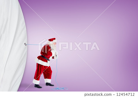Santa claus pulling a rope Santa claus pulling a rope 12454712