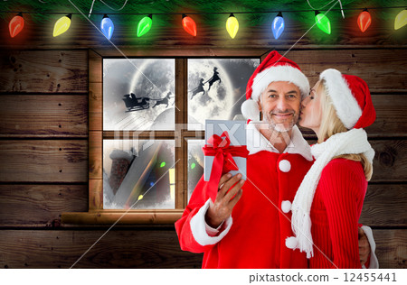 Composite image of festive couple 12455441