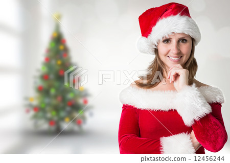Composite image of pretty girl in santa outfit 12456244