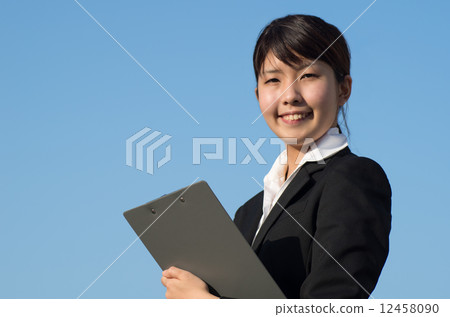 Check business woman blue sky background 12458090