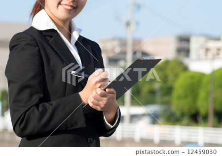 Check business woman blue sky street background 12459030