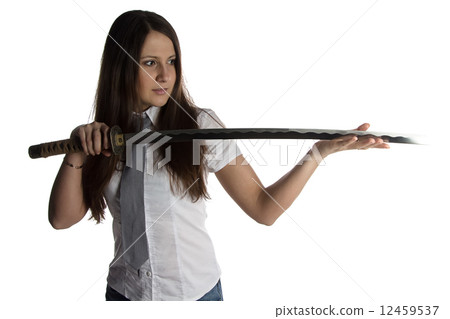 Photo of young woman looking at blade Photo of young woman looking at blade 12459537