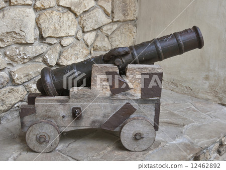 Ancient cannon on wooden carriage 12462892