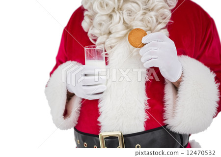 Santa holding glass of milk and cookie Santa holding glass of milk and cookie 12470532