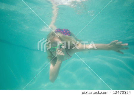 Cute kid posing underwater in pool Cute kid posing underwater in pool 12470534