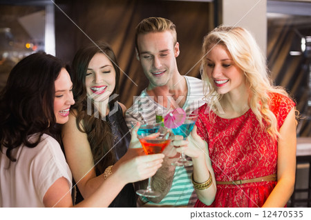 Young friends having a drink together Young friends having a drink together 12470535
