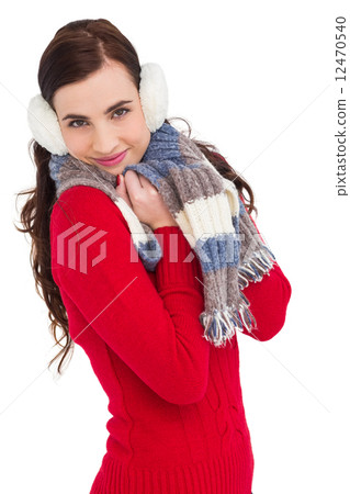 Pretty brunette in winter wear smiling at camera Pretty brunette in winter wear smiling at camera 12470540