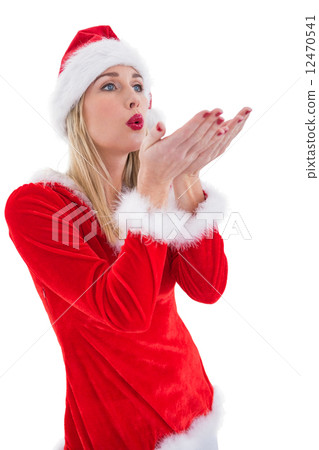 Festive blonde blowing over hands Festive blonde blowing over hands 12470541