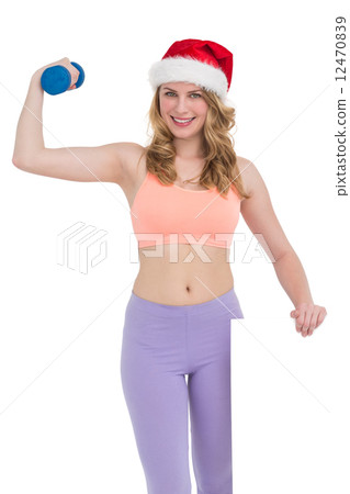 Festive fit blonde smiling at camera holding poster 12470839