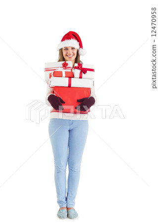 Festive young woman holding many gifts 12470958