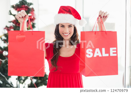 Brunette showing sale bag and shopping bag Brunette showing sale bag and shopping bag 12470979