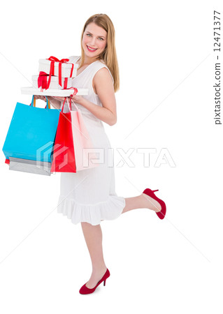 Elegant blonde with shopping bags and gifts Elegant blonde with shopping bags and gifts 12471377