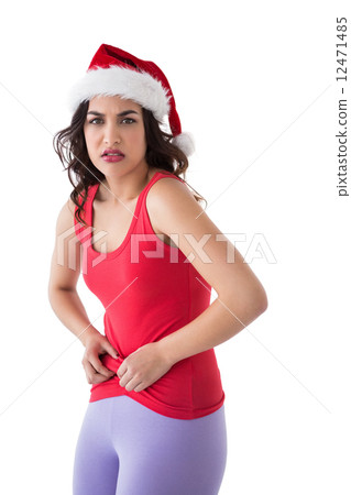 Festive fit brunette pinching her stomach Festive fit brunette pinching her stomach 12471485