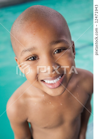 Cute little boy smiling at the pool 12471943