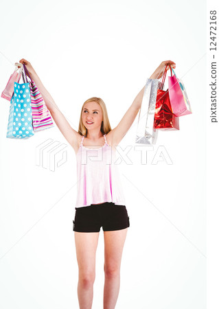Pretty young blonde holding shopping bags Pretty young blonde holding shopping bags 12472168