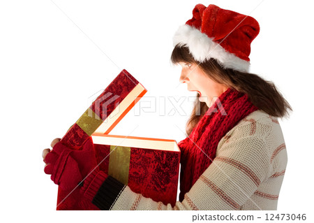 Festive brunette opening a glowing christmas gift Festive brunette opening a glowing christmas gift 12473046