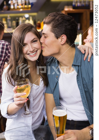 Young couple having a drink together Young couple having a drink together 12473052
