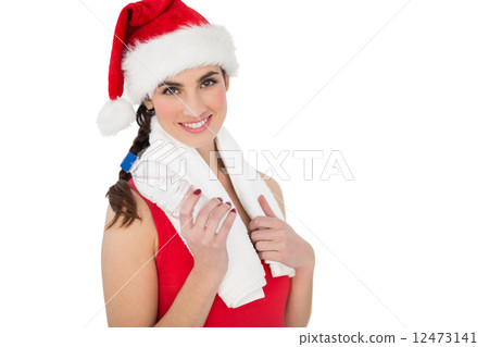 Festive fit brunette smiling at camera 12473141