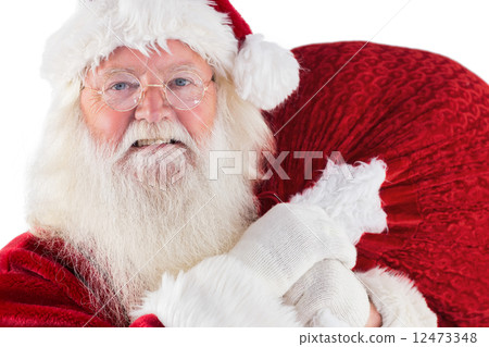 Jolly Santa carries his sack 12473348