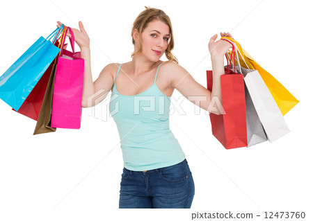 Cheerful woman holding shopping bags 12473760