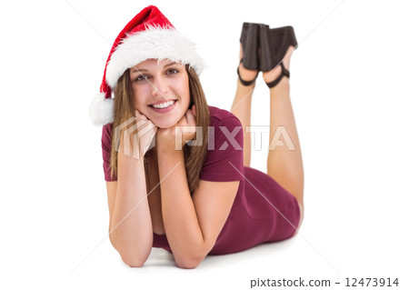 Festive brunette smiling at camera 12473914
