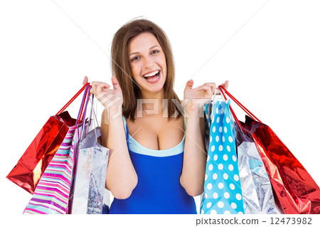 Cheerful brunette woman holding shopping bags Cheerful brunette woman holding shopping bags 12473982