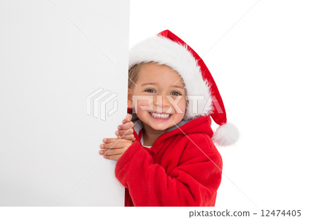 Festive little girl showing poster 12474405