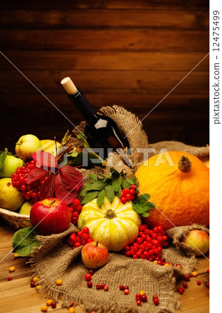 Thanksgiving day autumnal still life with bottle of wine Thanksgiving day autumnal still life with bottle of wine 12475499