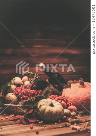 Thanksgiving day autumnal still life with bottle of wine Thanksgiving day autumnal still life with bottle of wine 12475501