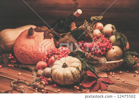 Thanksgiving day autumnal still life with bottle of wine Thanksgiving day autumnal still life with bottle of wine 12475502