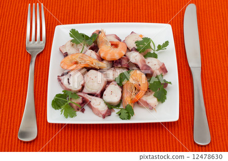 seafood salad with parsley on white plate 12478630