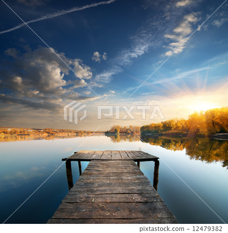 Pier on a calm river 12479382