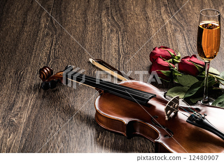 Violin, rose, glass of champagne and music books Violin, rose, glass of champagne and music books 12480907