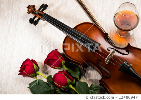 Violin, rose, glass of champagne and music books Violin, rose, glass of champagne and music books 12480947