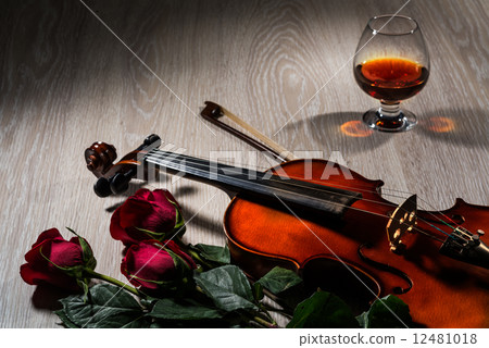Violin, rose, glass of champagne and music books 12481018