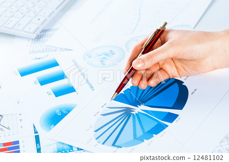 female hand pointing to the financial growth chart female hand pointing to the financial growth chart 12481102