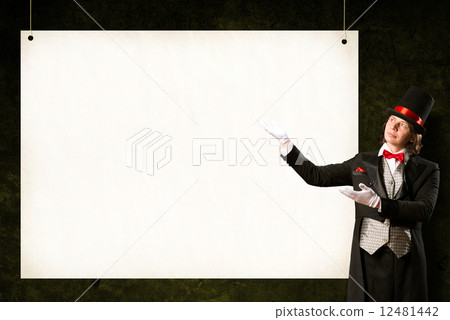 magician in top hat and tie points to the banner magician in top hat and tie points to the banner 12481442