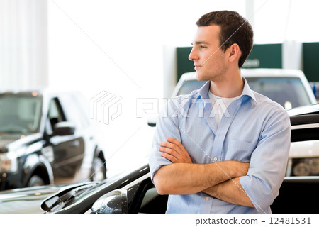 man standing near a car man standing near a car 12481531