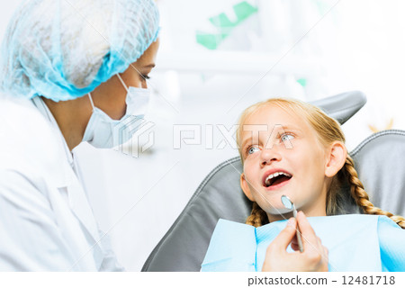Dentist inspecting patient Dentist inspecting patient 12481718