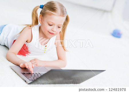 Pretty girl working on a laptop 12481978